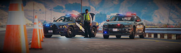 2014 DPS Charger and SSPD Charger establishing safe road block for Officer-involved 10-50.